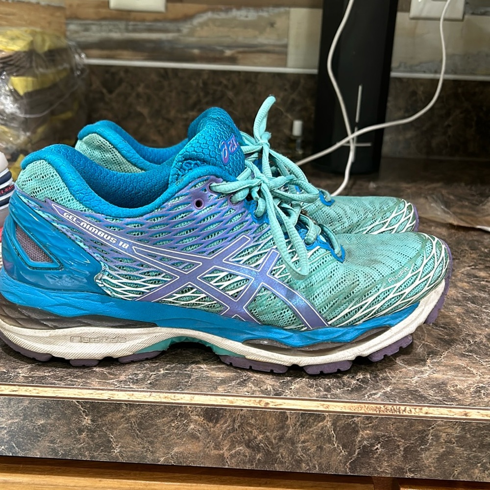 ASICS women’s gel nimbus 18.  I am sizing down.  They still have life in them!